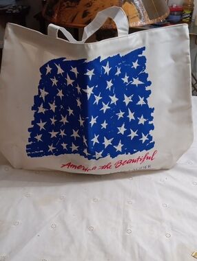 Estee Lauder Blue and Cream Canvas Tote with Star Graphic